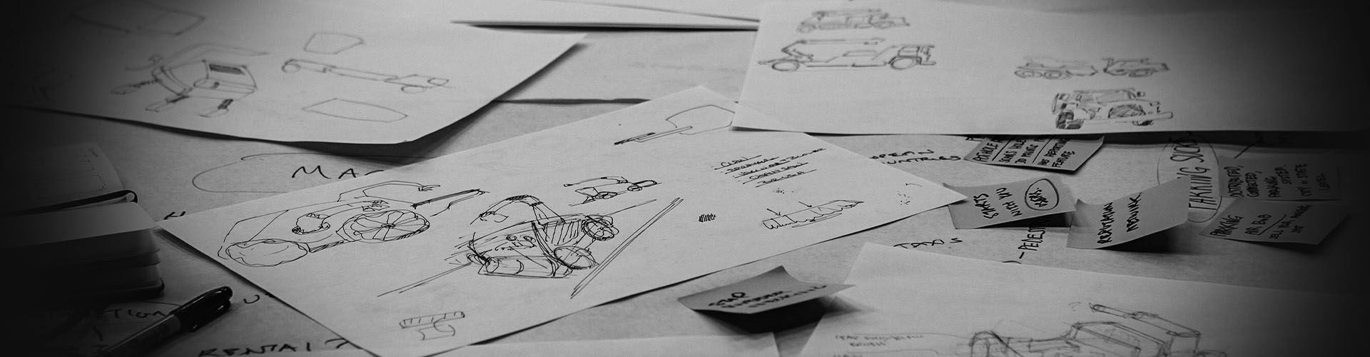 a table of industrail design sketching as a backdrop